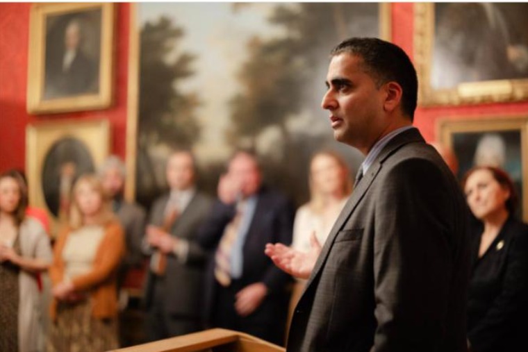 A speaker addressing guests at a Doctors in Distress reception at Downing Street