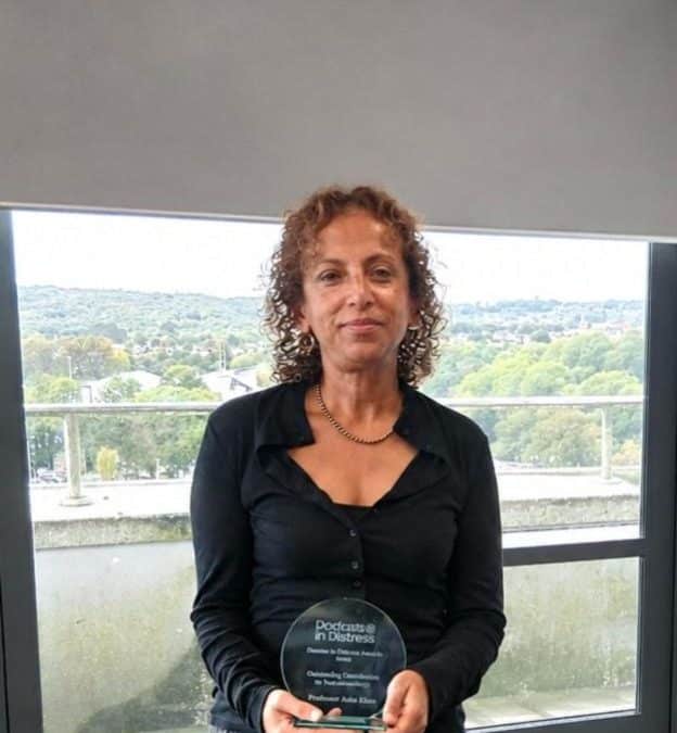 Professor Ann John OBE holding her Doctors in Distress award